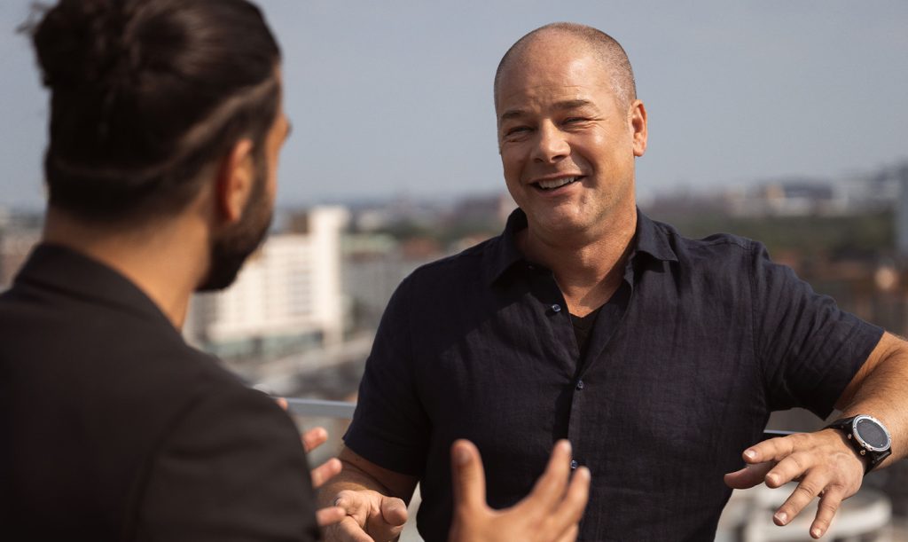 Tommy Strand, Chief Network Architect at Telia, is seen talking to one of his colleagues.